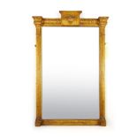 A Regency giltwood mirror, the plate flanked by fluted columns,