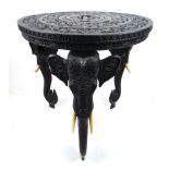 An early 20th century Indian carved ebonized teak occasional table,