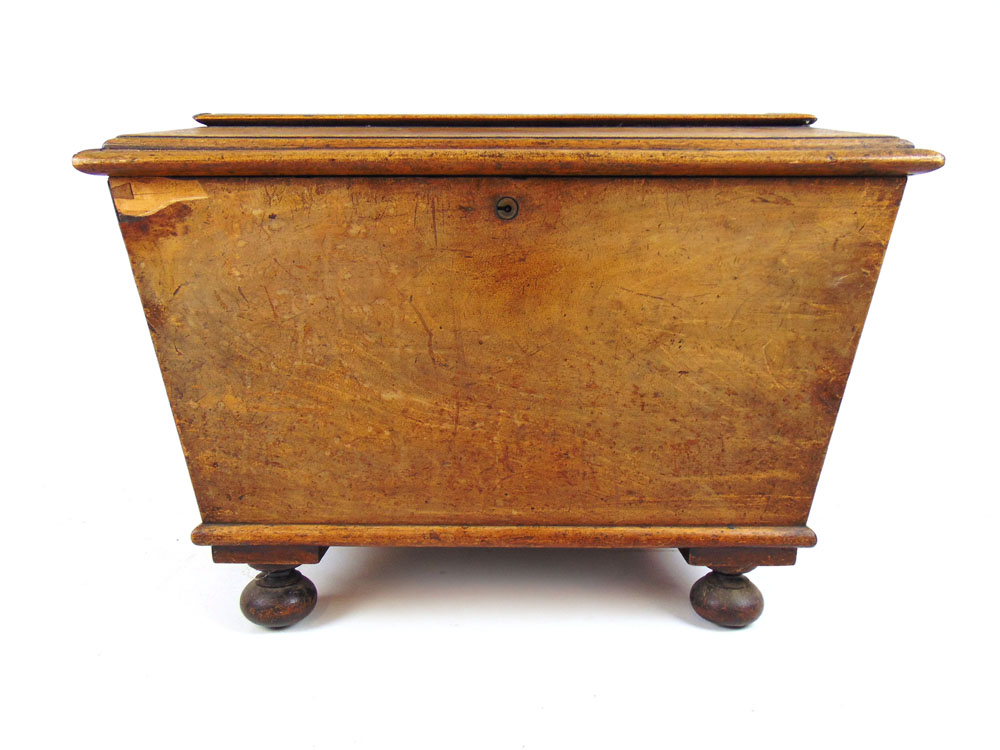 An early 19th century mahogany cellaret of sarcophagus form,