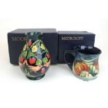 A Moorcroft Anna pattern mug together with a Moorcroft Bird and Berry pattern vase, h.