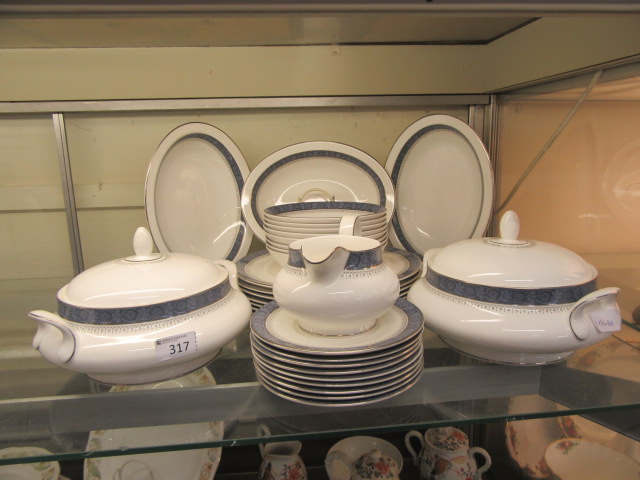 A part Royal Doulton dinner set 'Sherbrooke' comprising of meat plates, tureens, bowls,