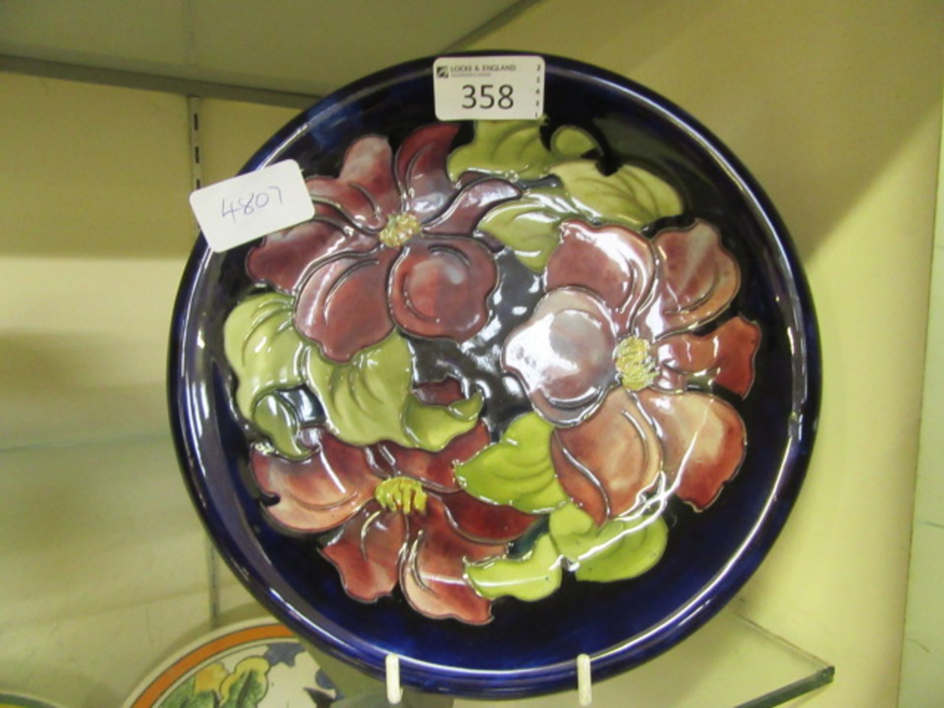 A blue ground Moorcroft plate