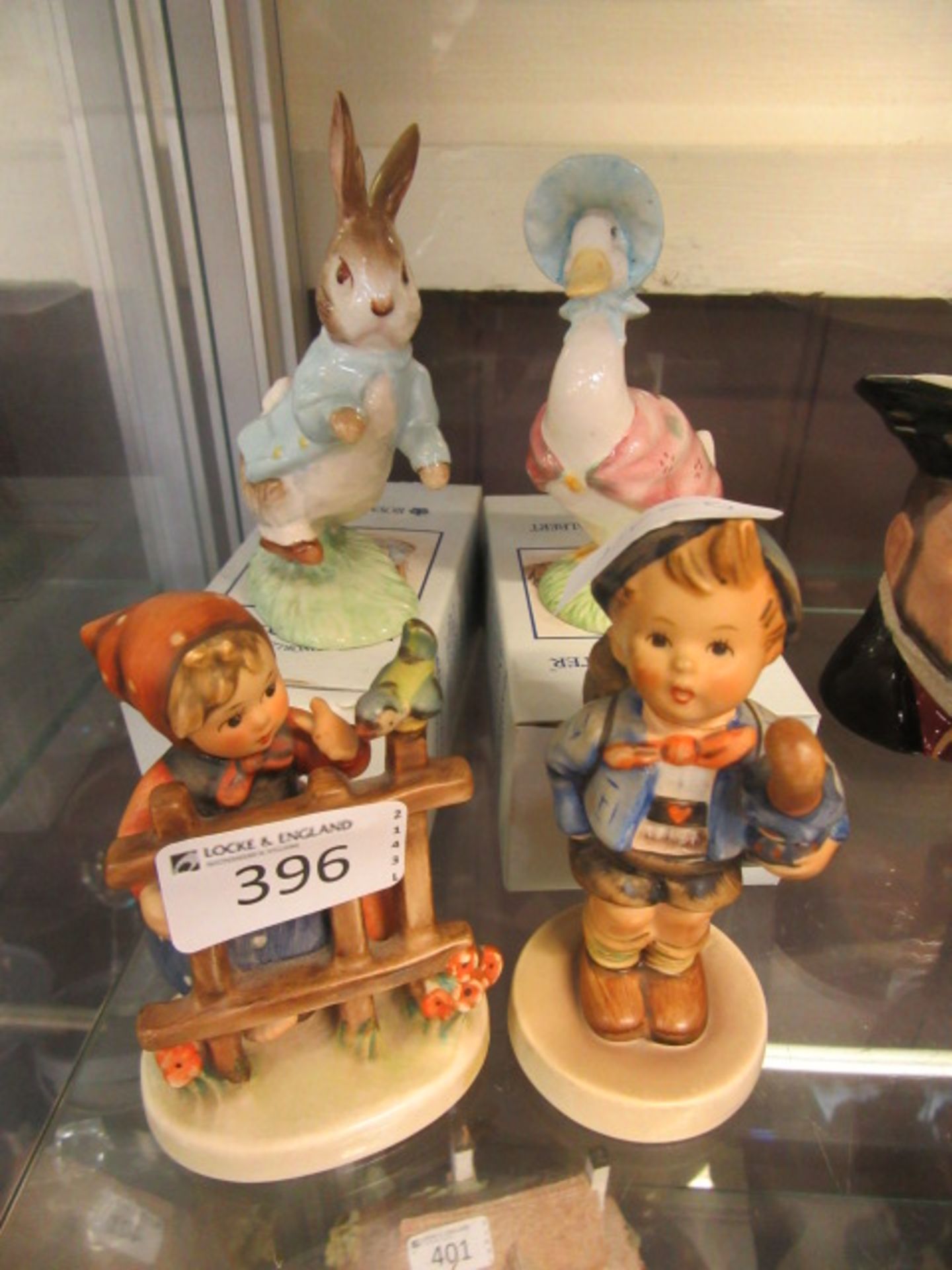 Two Royal Albert 'Beatrix Potter' figures of rabbit and duck together with two Goebel figures