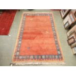 A hand woven Caucasian rug,