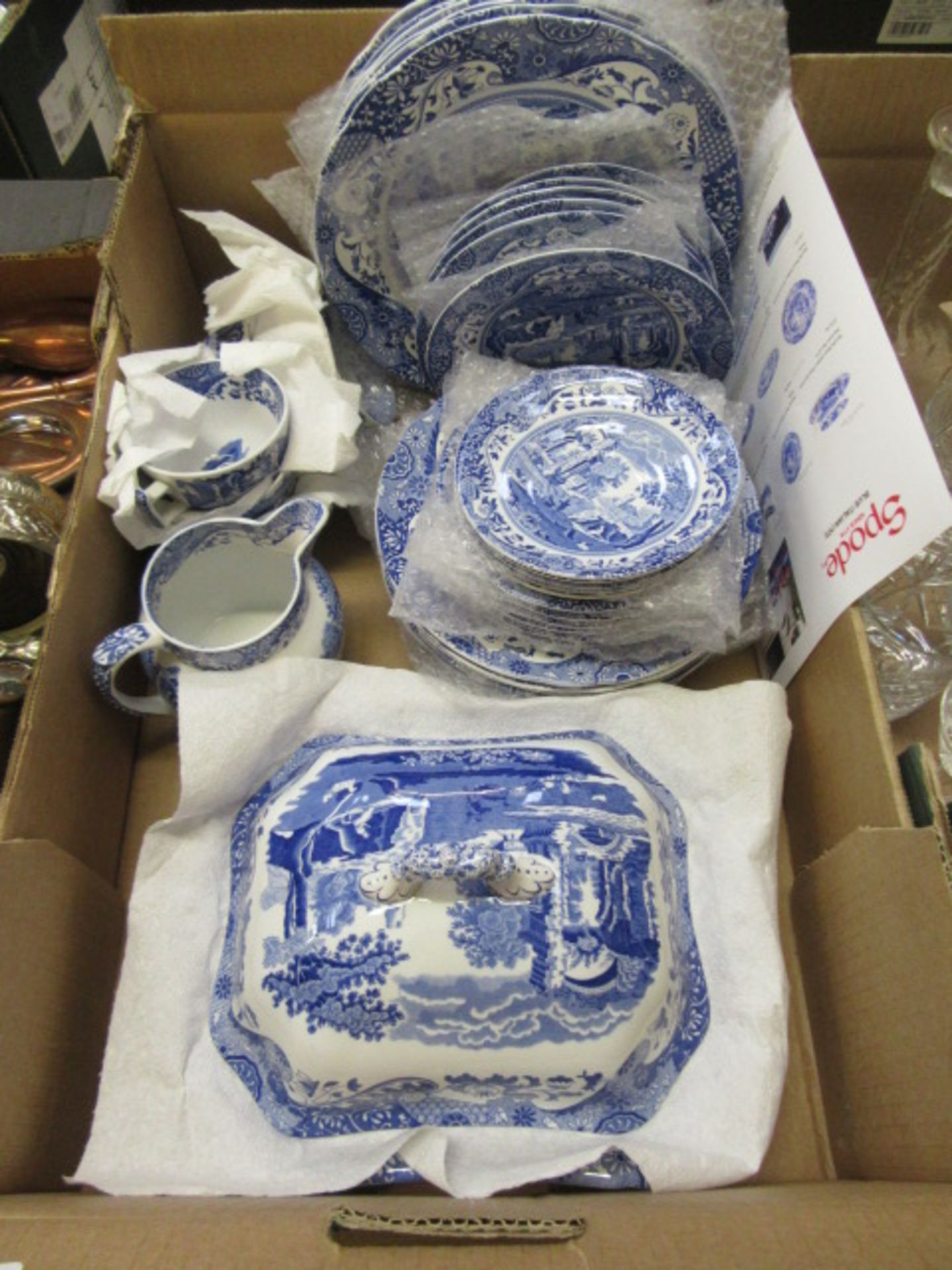 A tray containing a quantity of Spode blue and white tableware to include cups, saucers, plates,