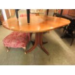 A mid-20th century teak extending dining table