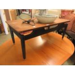 A mid-20th century teak coffee table with ebonised base