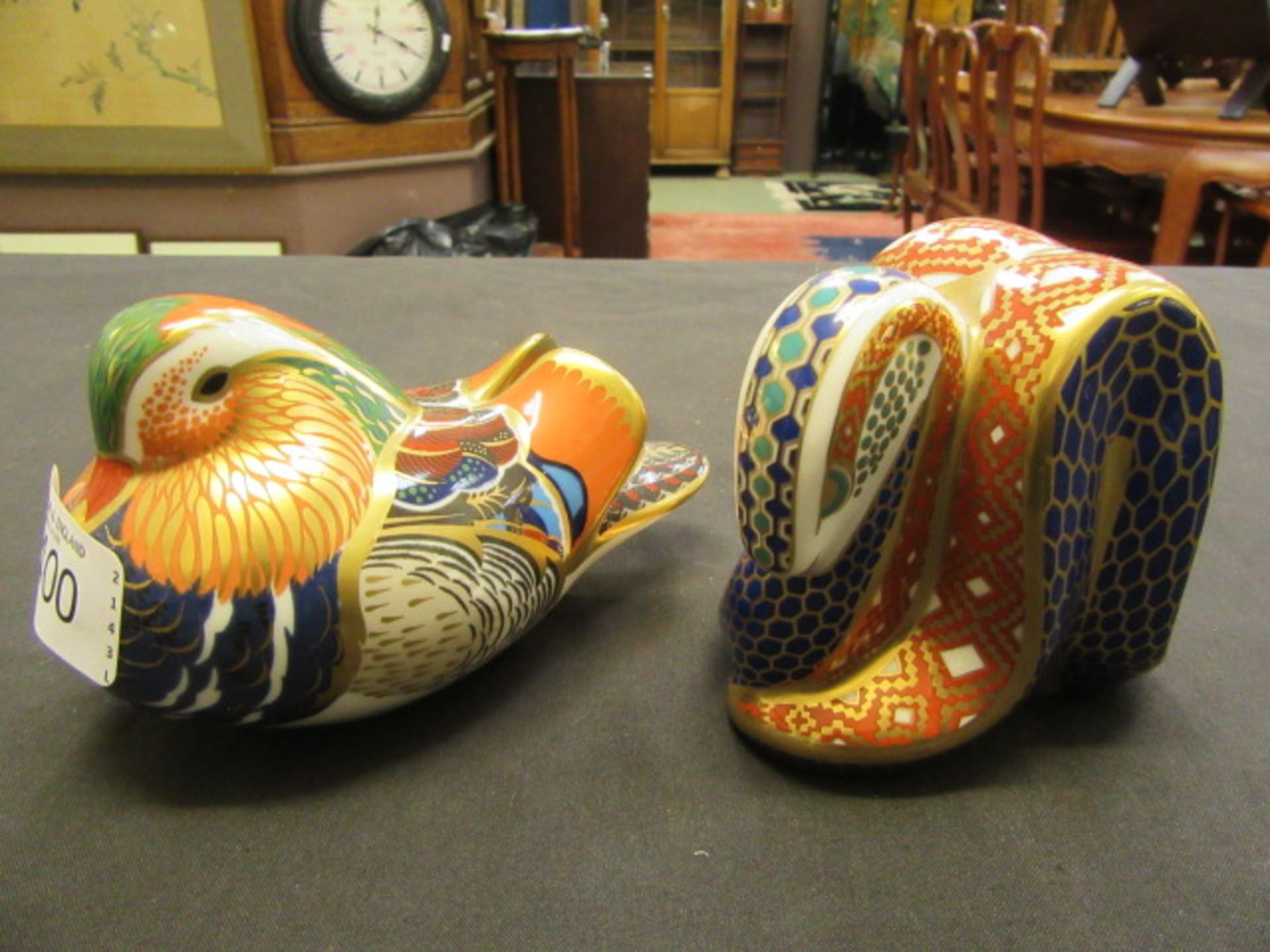 Two Royal Crown Derby paperweights one of a snail,