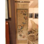 A Chinese silk wall hanging rug depicting birds on branch