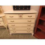 A cream and parcel gilt chest of five drawers