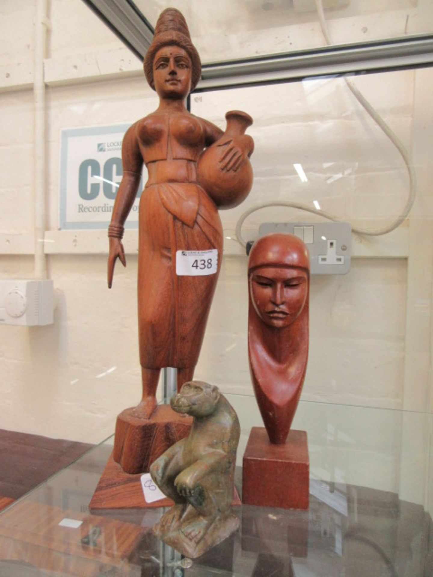 A carved wooden figure of Indian lady together with a carved figure of eastern lady and a green