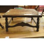 An early 20th century oak burgere seated footstool