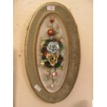 An early 20th century ceramic plaque of three dimensional flowers signed Assalini Ticke