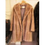 A light brown fur coat by Brahms