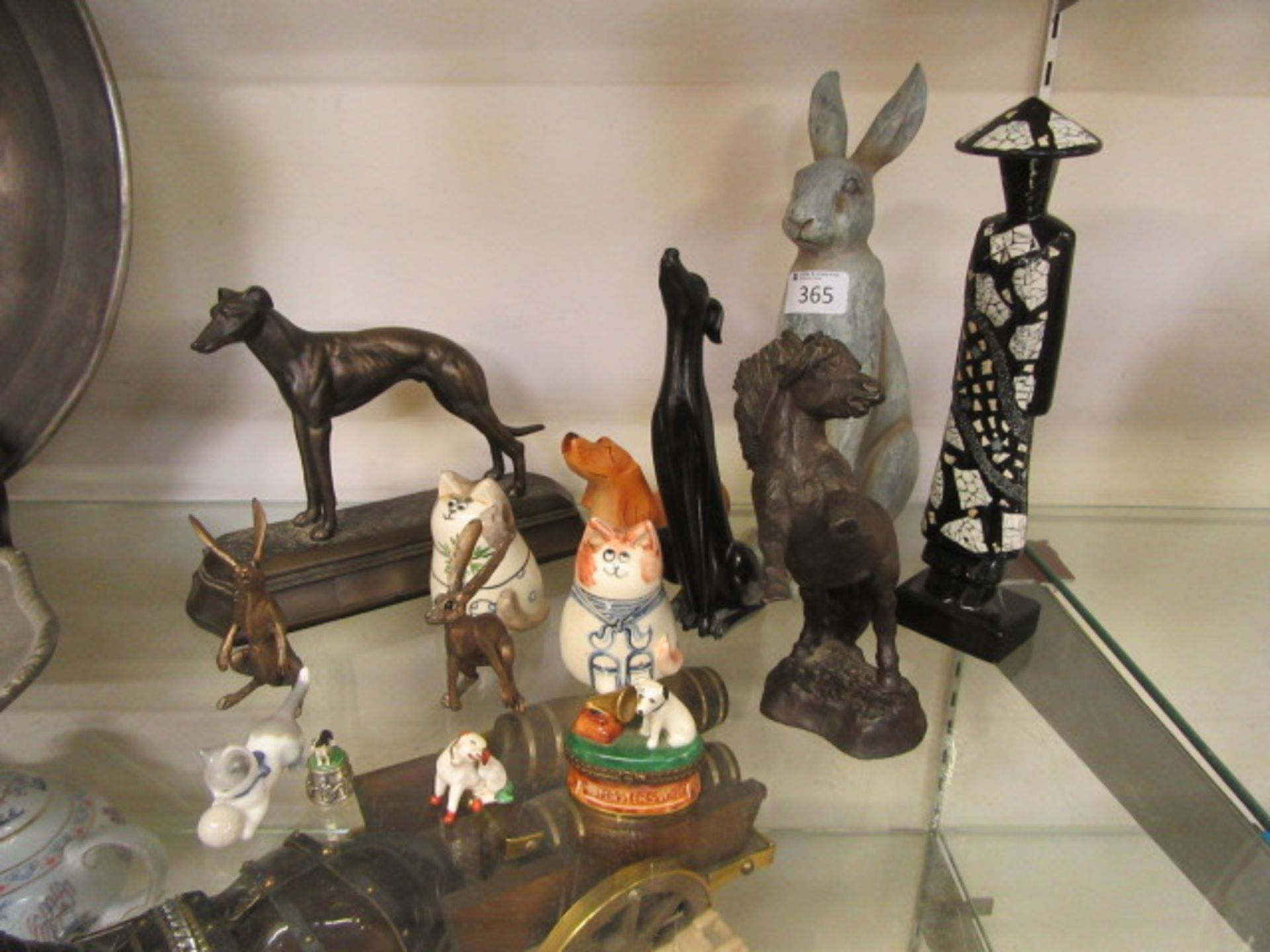 A selection of cast, moulded, and other ceramic ware to include rabbits, horses, dogs, cats,