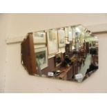 A mid-20th century bevel glass wall mirror