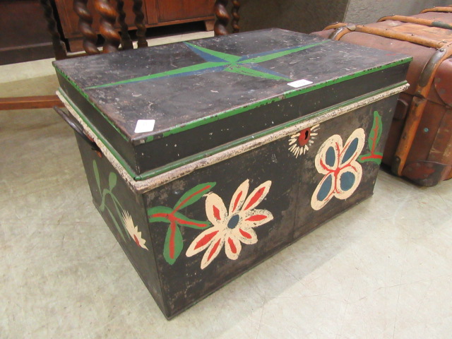 A painted metal travelling trunk