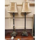 A pair of faux bamboo columned table lamps