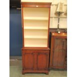 A reproduction mahogany open bookcase,