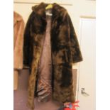 A dark brown fur coat by 'Brian's furs,