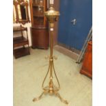 An early 20th century brass floor standing oil lamp