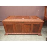 A mid-20th century carved oak panelled ottoman