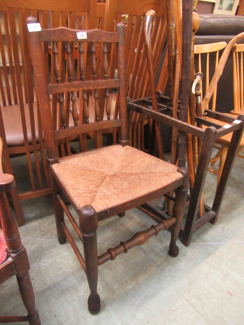 A spindle back seagrass seated chair