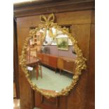 An ornate gilt framed wall mirror