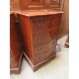 A reproduction burr elm serpentine fronted chest of four drawers