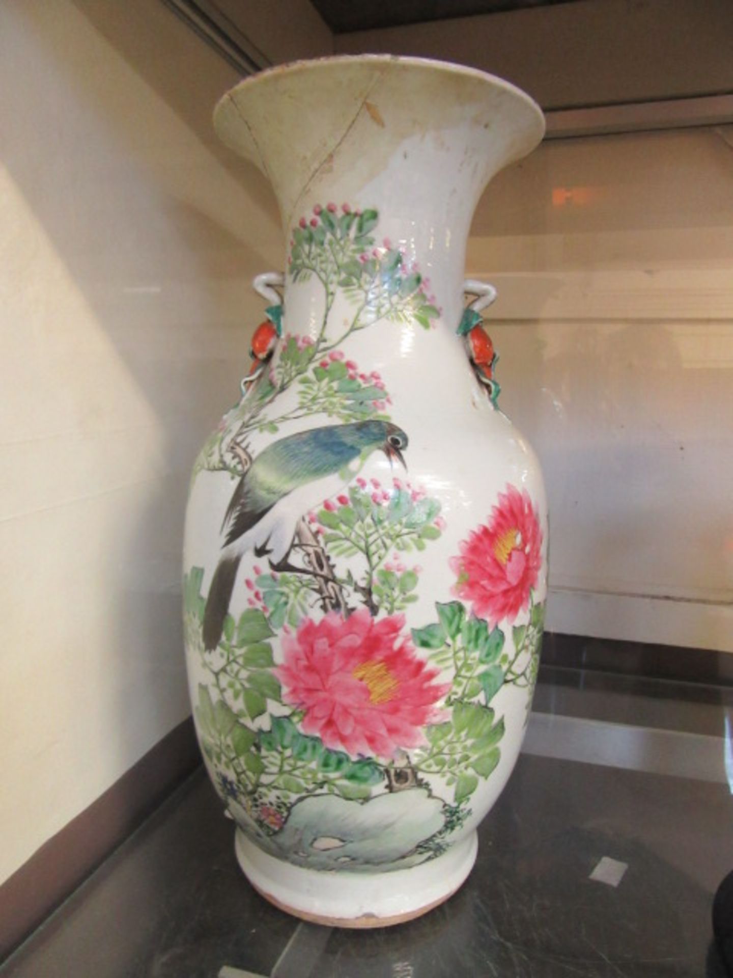 A Chinese ceramic vase with bird on branch design and poem on back (A/F)