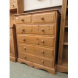 A waxed pine chest of two short over three longer drawers