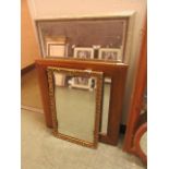 Three assorted framed wall mirrors