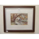 A modern framed and glazed watercolour of cottage by river scene