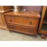 A mid-20th century oak chest of two drawers