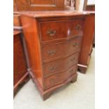 A reproduction burr elm serpentine fronted chest of four drawers