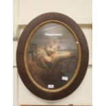 An early 20th century oval framed and glazed print of young girl