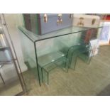 A bent glass side table