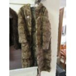 A light brown fur coat by Studio Exclusive Fur International