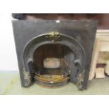 A black cast metal fire surround