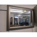 A silver framed bevel glass mirror