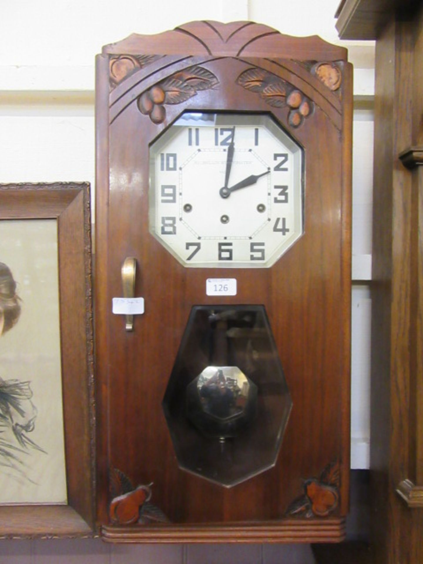 An early 20th century walnut cased drop dial wall clock