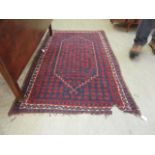 A hand woven Persian blue ground rug (A/F)