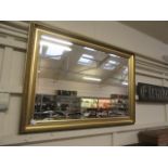 A modern gilt framed bevel glass mirror