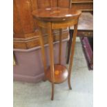 An early 20th century mahogany and marquetry jardiniere stand