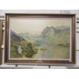 A framed oleograph of cattle in lake scene titled 'Highland Peaks' after De Brenski