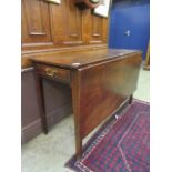 An 18th century mahogany drop leaf table,