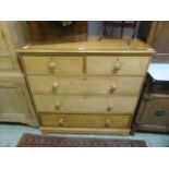 A 19th century pine chest of two short over three long drawers with painted banding