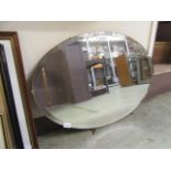 An early 20th century oval bevel glass mirror (A/F)