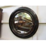 An early 20th century faux wood framed circular mirror CONDITION REPORT: