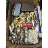 A tray of assorted loose flatware, napkin rings,